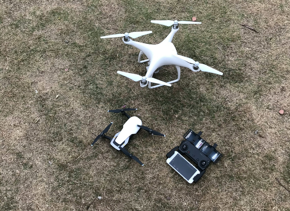 Drone hovering over landscape capturing aerial photograph